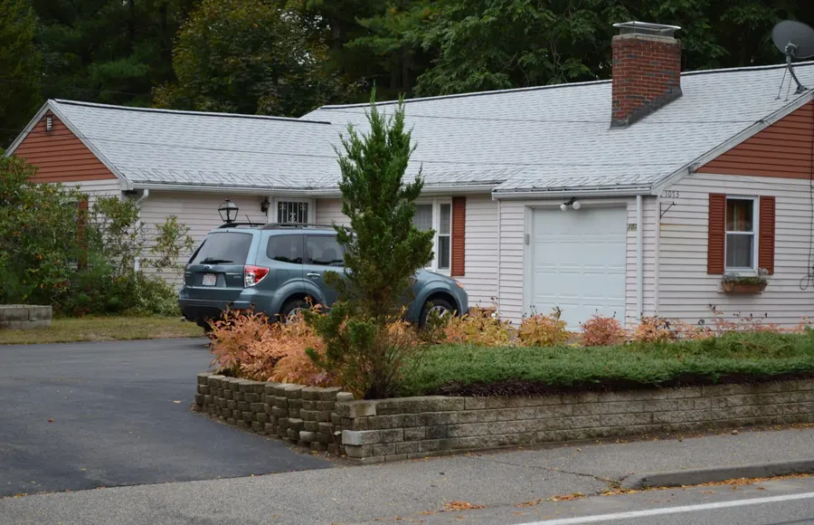 Completed roofing project on a two-story New England home
